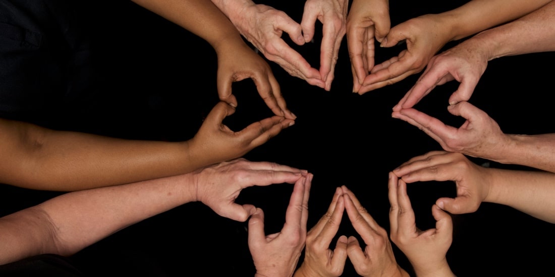 Hands joined in a pattern to form a star